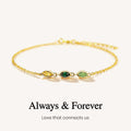 Gold bracelet with green gemstones on a white background, featuring the text 'Always & Forever'.