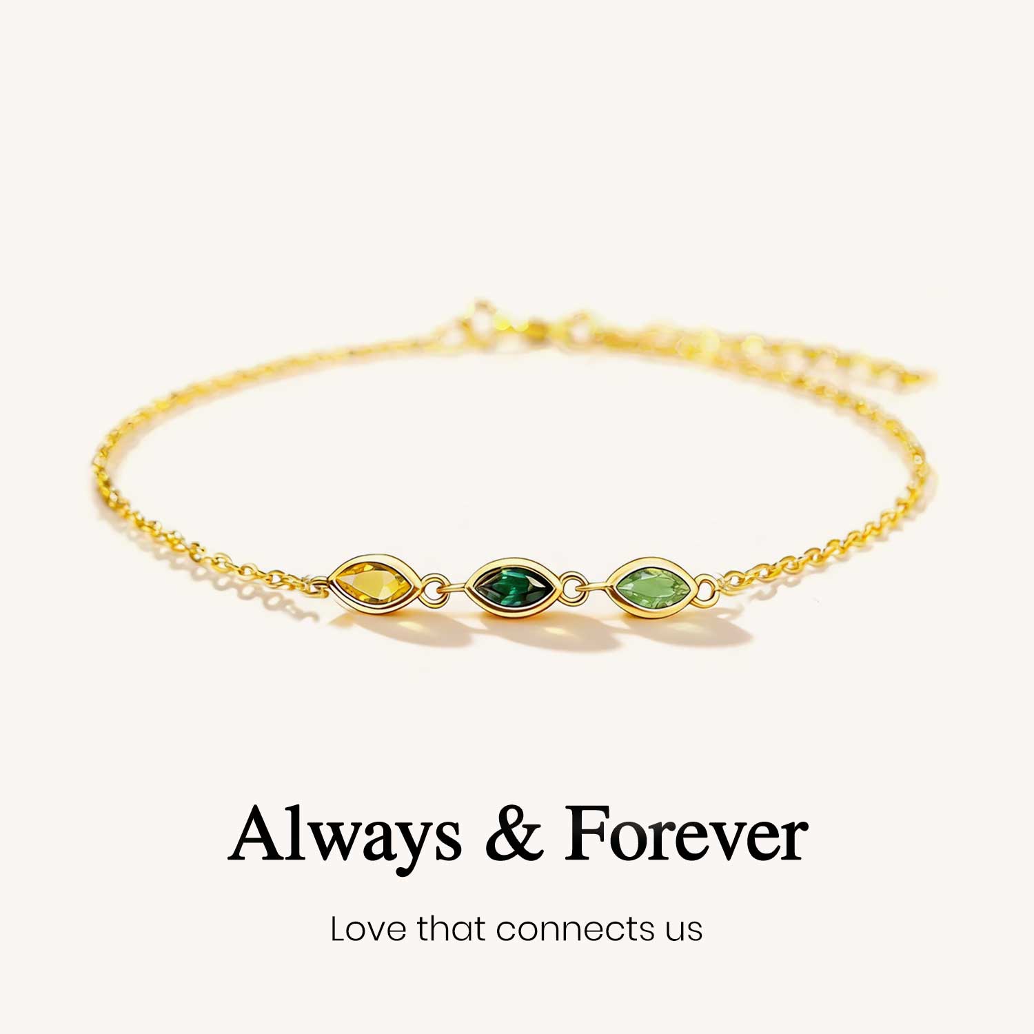 Gold bracelet with green gemstones on a white background, featuring the text 'Always & Forever'.