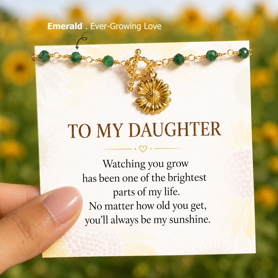 sunflower pendant emerald bracelet, meaningful symbolic jewelry