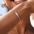 Silver opal bracelet worn on wrist